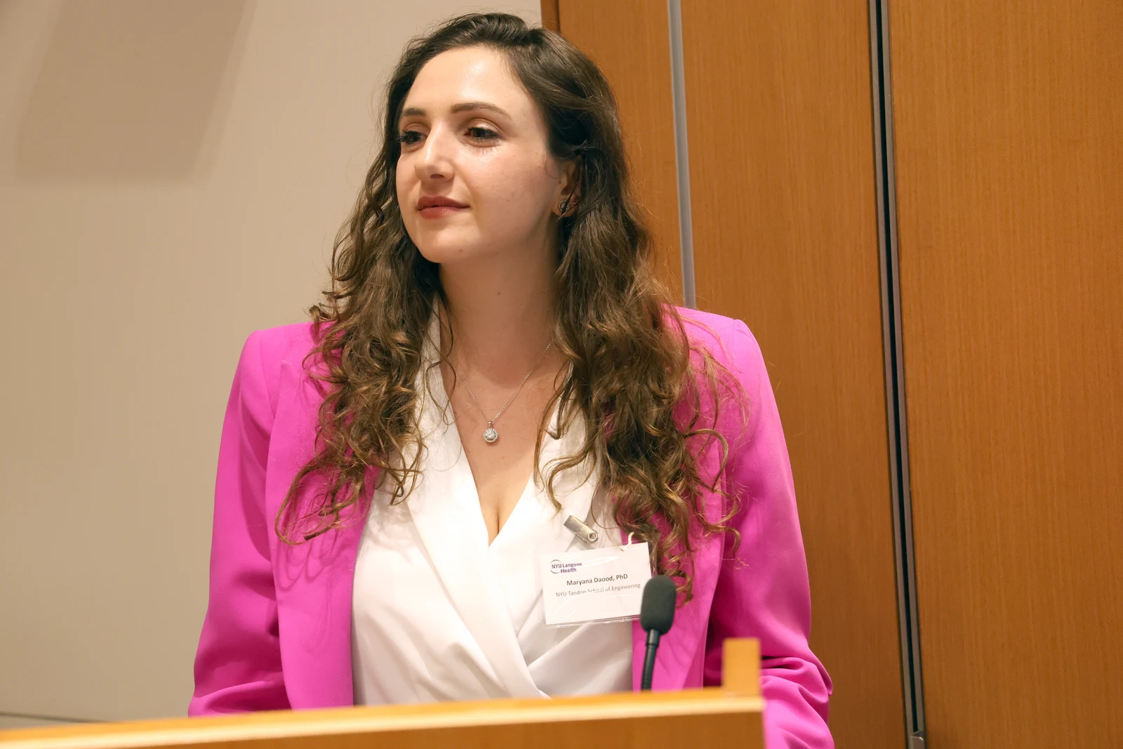 Maryana Daood speaking at a lectern at an NYU Langone Health event